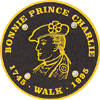 Waymark: Prince's head and name in gold on brown disc