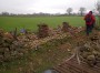 Stone-wall repairs. A professional job being done Stone-wall repairs. A professional job being done
