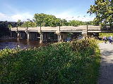 West Coast main line crosses the river. The original bridge beyond the newer span