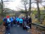  Peter gathers the group together with the viaduct at Healey Dell in the background