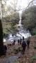 The group survey the waterfall The group survey the waterfall