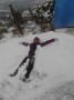 Julie makes a snow angel. Julie makes a snow angel.