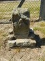 Carved stone post by the water works Carved stone post by the water works