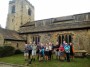  The group outside Ribchester Church, Bernard points at the clock.