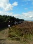 All in a line on the fell top path. All in a line on the fell top path.