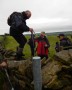 A very awkward wall stile, Don and John hold hands A very awkward wall stile, Don and John hold hands