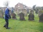 &nbsp;Studying a row of the graves from the disaster
