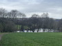By the water