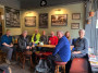 All smiles, just like the good ol days, group photo in a boozer